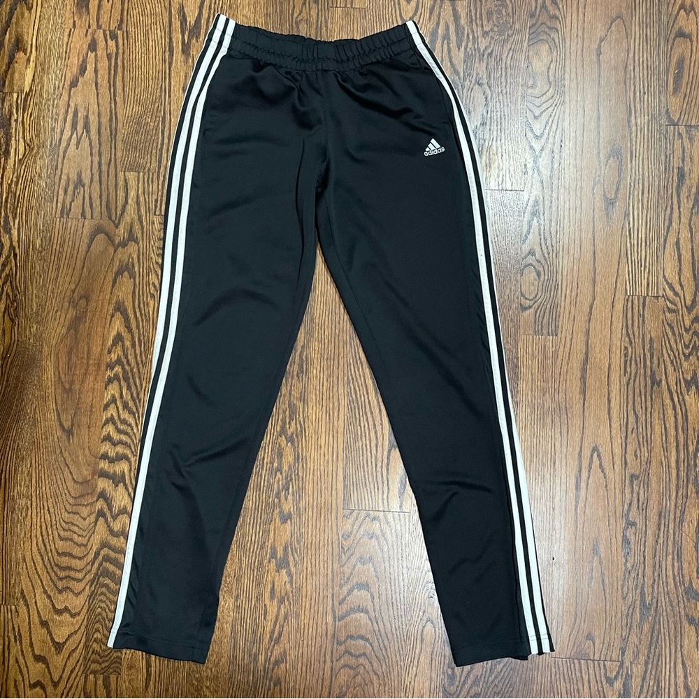 Adidas Pants with zipper on legs. Black with white stripe. Size Medium.